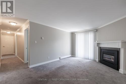 213 - 440 Wellington Street, St. Thomas, ON - Indoor With Fireplace