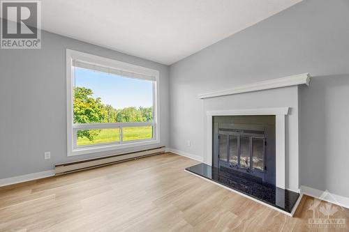 754 St Andre Drive Unit#80A, Ottawa, ON - Indoor Photo Showing Living Room With Fireplace