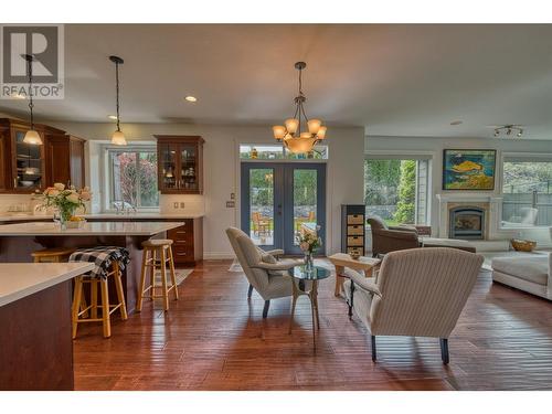 5254 Cobble Crescent, Kelowna, BC - Indoor Photo Showing Dining Room With Fireplace