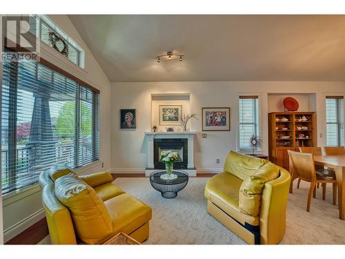 5254 Cobble Crescent, Kelowna, BC - Indoor Photo Showing Living Room With Fireplace