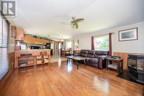 20 Hunters Run Lane, Laurentian Hills, ON - Indoor Photo Showing Living Room With Fireplace