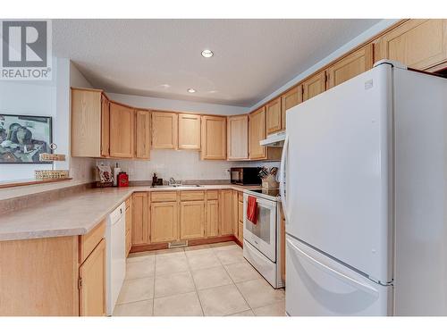 6909 Manning Place Unit# 2, Vernon, BC - Indoor Photo Showing Kitchen With Double Sink