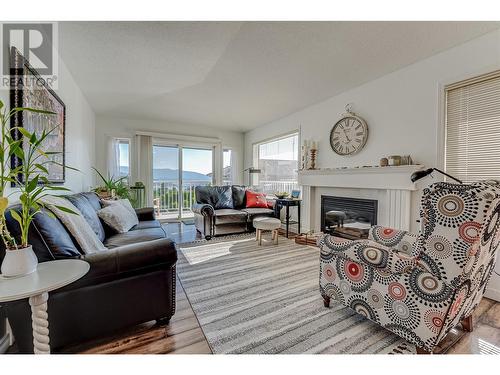 6909 Manning Place Unit# 2, Vernon, BC - Indoor Photo Showing Living Room With Fireplace