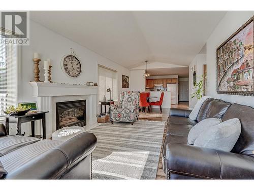 6909 Manning Place Unit# 2, Vernon, BC - Indoor Photo Showing Living Room With Fireplace