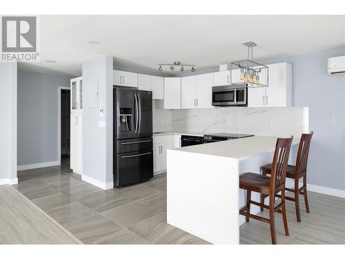 737 Leon Avenue Unit# 1204, Kelowna, BC - Indoor Photo Showing Kitchen With Double Sink