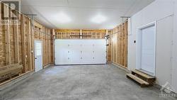 Man door & garage door opener in garage - 