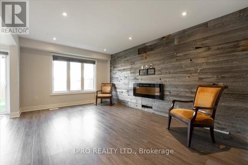 7739 Shaw Street, Niagara Falls, ON - Indoor Photo Showing Living Room With Fireplace