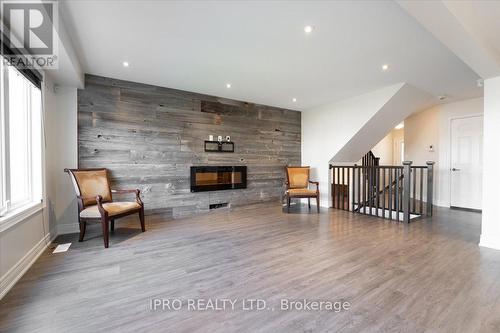 7739 Shaw Street, Niagara Falls, ON - Indoor With Fireplace