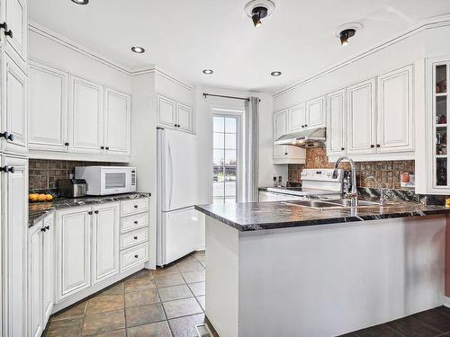 Cuisine - 1099 Boul. Iberville, Repentigny (Repentigny), QC - Indoor Photo Showing Kitchen With Double Sink