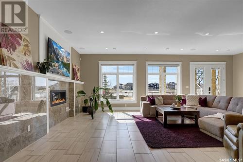 330 Spruce Creek Drive, Edenwold Rm No. 158, SK - Indoor Photo Showing Living Room With Fireplace