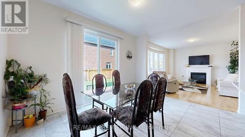 288 Elbern Markell Drive, Brampton, ON - Indoor Photo Showing Dining Room With Fireplace