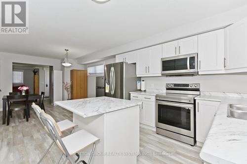 50 - 7768 Ascot Circle, Niagara Falls, ON - Indoor Photo Showing Kitchen With Double Sink