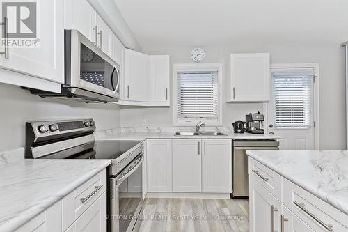 50 - 7768 Ascot Circle, Niagara Falls, ON - Indoor Photo Showing Kitchen With Double Sink