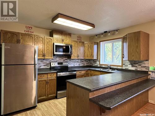 30 Marion Crescent, Meadow Lake, SK - Indoor Photo Showing Kitchen With Double Sink