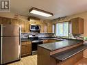 30 Marion Crescent, Meadow Lake, SK  - Indoor Photo Showing Kitchen With Double Sink 