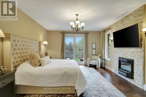 209 Hume Road, Puslinch, ON - Indoor Photo Showing Bedroom With Fireplace