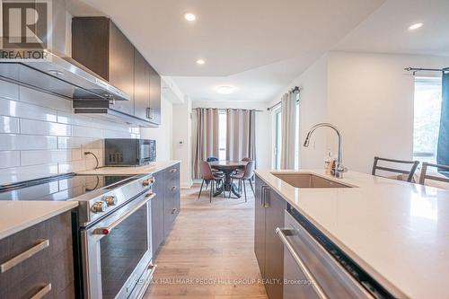 306 - 58 Lakeside Terrace, Barrie (Little Lake), ON - Indoor Photo Showing Kitchen With Stainless Steel Kitchen With Upgraded Kitchen