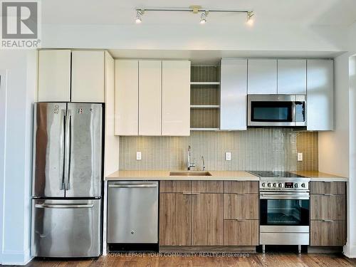 504 - 33 Shore Breeze Drive, Toronto, ON - Indoor Photo Showing Kitchen With Upgraded Kitchen