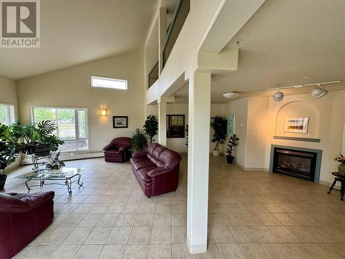 11001 13 Street Unit# 302, Dawson Creek, BC - Indoor Photo Showing Living Room With Fireplace