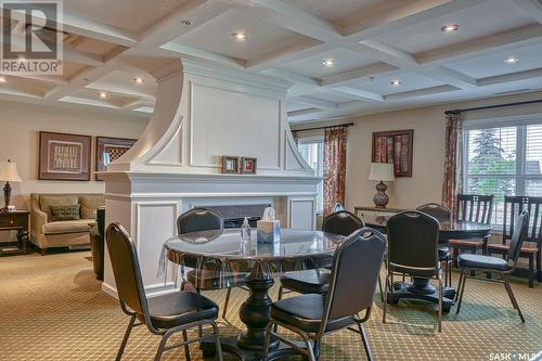 200 917 Bradley Street, Moose Jaw, SK - Indoor Photo Showing Dining Room With Fireplace