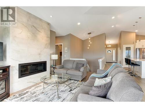 3950 Cimarron Drive, Kelowna, BC - Indoor Photo Showing Living Room With Fireplace