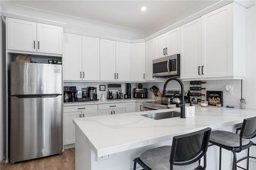 132 Holton Avenue S, Hamilton, ON - Indoor Photo Showing Kitchen With Double Sink