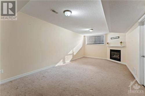 608 Glastonbury Walk, Ottawa, ON - Indoor Photo Showing Other Room With Fireplace