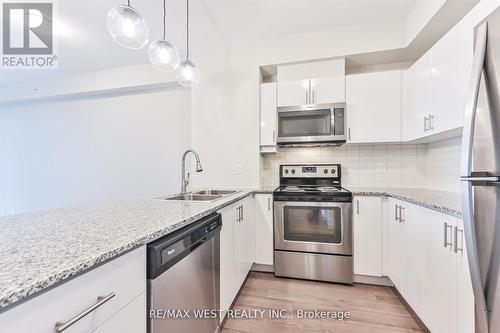 606 - 2900 Highway 7 Road, Vaughan, ON - Indoor Photo Showing Kitchen With Stainless Steel Kitchen With Double Sink With Upgraded Kitchen