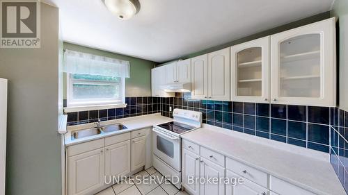 7028 Justine Drive, Mississauga, ON - Indoor Photo Showing Kitchen With Double Sink