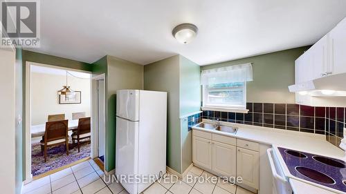 7028 Justine Drive, Mississauga, ON - Indoor Photo Showing Kitchen With Double Sink