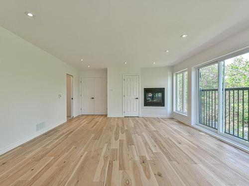 Master bedroom - 55 Ch. De Normandie, Sainte-Agathe-Des-Monts, QC - Indoor With Fireplace