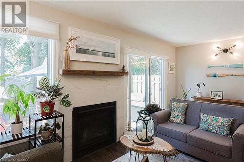 NG fireplace with modern tile surround - 160 Morpeth Street Unit# 19, Southampton, ON - Indoor Photo Showing Living Room With Fireplace