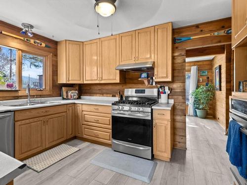 435 Dodding Ave, Merritt, BC - Indoor Photo Showing Kitchen With Fireplace With Double Sink