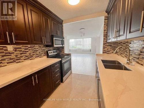 709 - 40 Panorama Court, Toronto (Mount Olive-Silverstone-Jamestown), ON - Indoor Photo Showing Kitchen With Double Sink