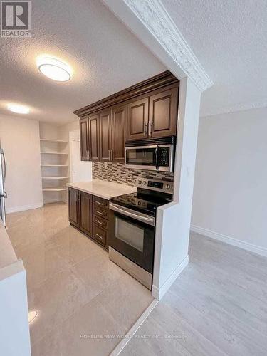 709 - 40 Panorama Court, Toronto (Mount Olive-Silverstone-Jamestown), ON - Indoor Photo Showing Kitchen