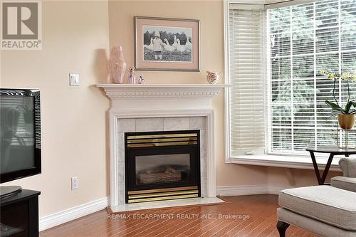 202 - 970 Golf Links Road, Hamilton (Ancaster), ON - Indoor Photo Showing Living Room With Fireplace