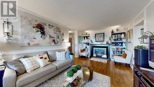 604 - 121 Trudelle Street, Toronto (Eglinton East), ON - Indoor Photo Showing Living Room With Fireplace