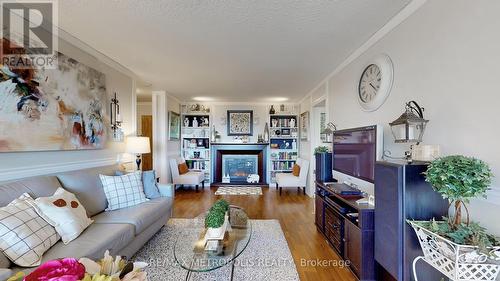 604 - 121 Trudelle Street, Toronto (Eglinton East), ON - Indoor Photo Showing Living Room With Fireplace