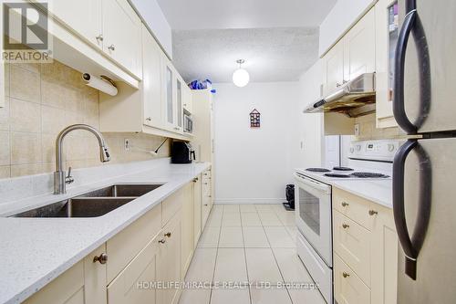 911 - 100 Echo Point, Toronto (L'Amoreaux), ON - Indoor Photo Showing Kitchen With Double Sink