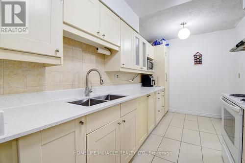 911 - 100 Echo Point, Toronto (L'Amoreaux), ON - Indoor Photo Showing Kitchen With Double Sink