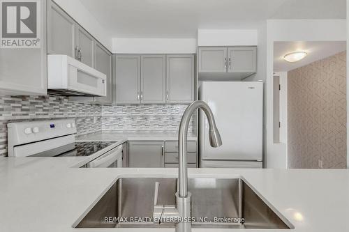 711 - 2177 Burnhamthorpe Road W, Mississauga, ON - Indoor Photo Showing Kitchen With Upgraded Kitchen