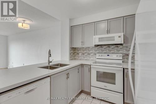 711 - 2177 Burnhamthorpe Road W, Mississauga (Erin Mills), ON - Indoor Photo Showing Kitchen With Double Sink