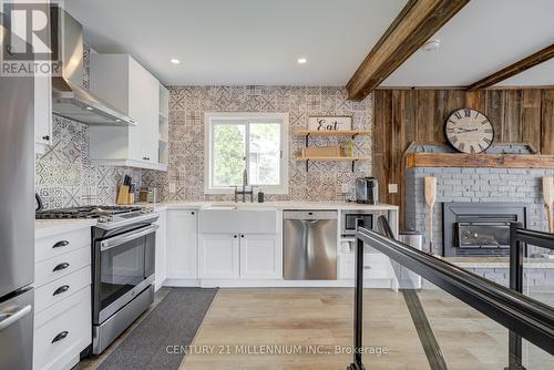 16 William Avenue, Wasaga Beach, ON - Indoor Photo Showing Kitchen With Fireplace With Upgraded Kitchen