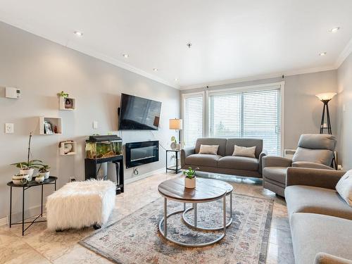 Salon - 712-505 Rue St-Francois, Brossard, QC - Indoor Photo Showing Living Room With Fireplace