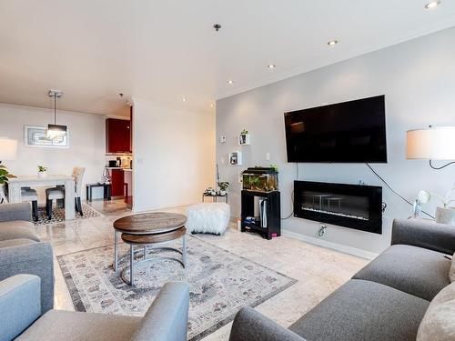 Salon - 712-505 Rue St-Francois, Brossard, QC - Indoor Photo Showing Living Room With Fireplace