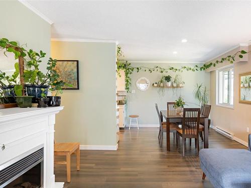 406-1039 Linden Ave, Victoria, BC - Indoor Photo Showing Dining Room With Fireplace