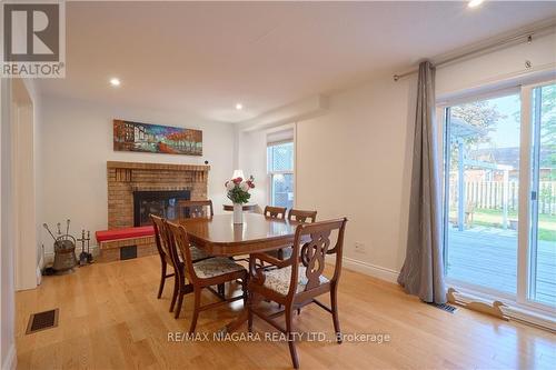 6 Lower Canada Drive, Niagara-On-The-Lake, ON - Indoor Photo Showing Dining Room With Fireplace