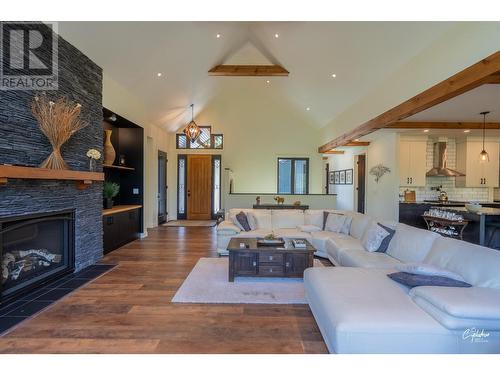 8660 Riverside Drive, Grand Forks, BC - Indoor Photo Showing Living Room With Fireplace