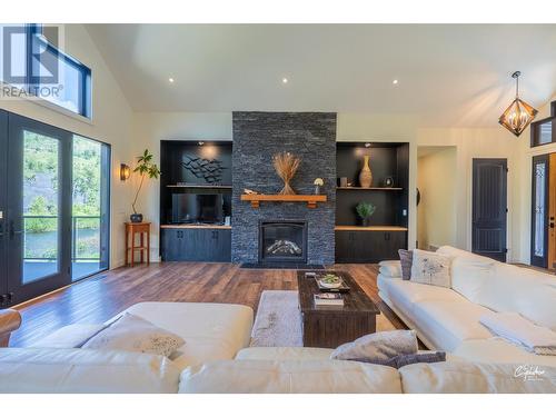 8660 Riverside Drive, Grand Forks, BC - Indoor Photo Showing Living Room With Fireplace