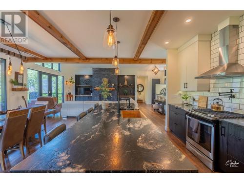 8660 Riverside Drive, Grand Forks, BC - Indoor Photo Showing Kitchen With Fireplace With Upgraded Kitchen